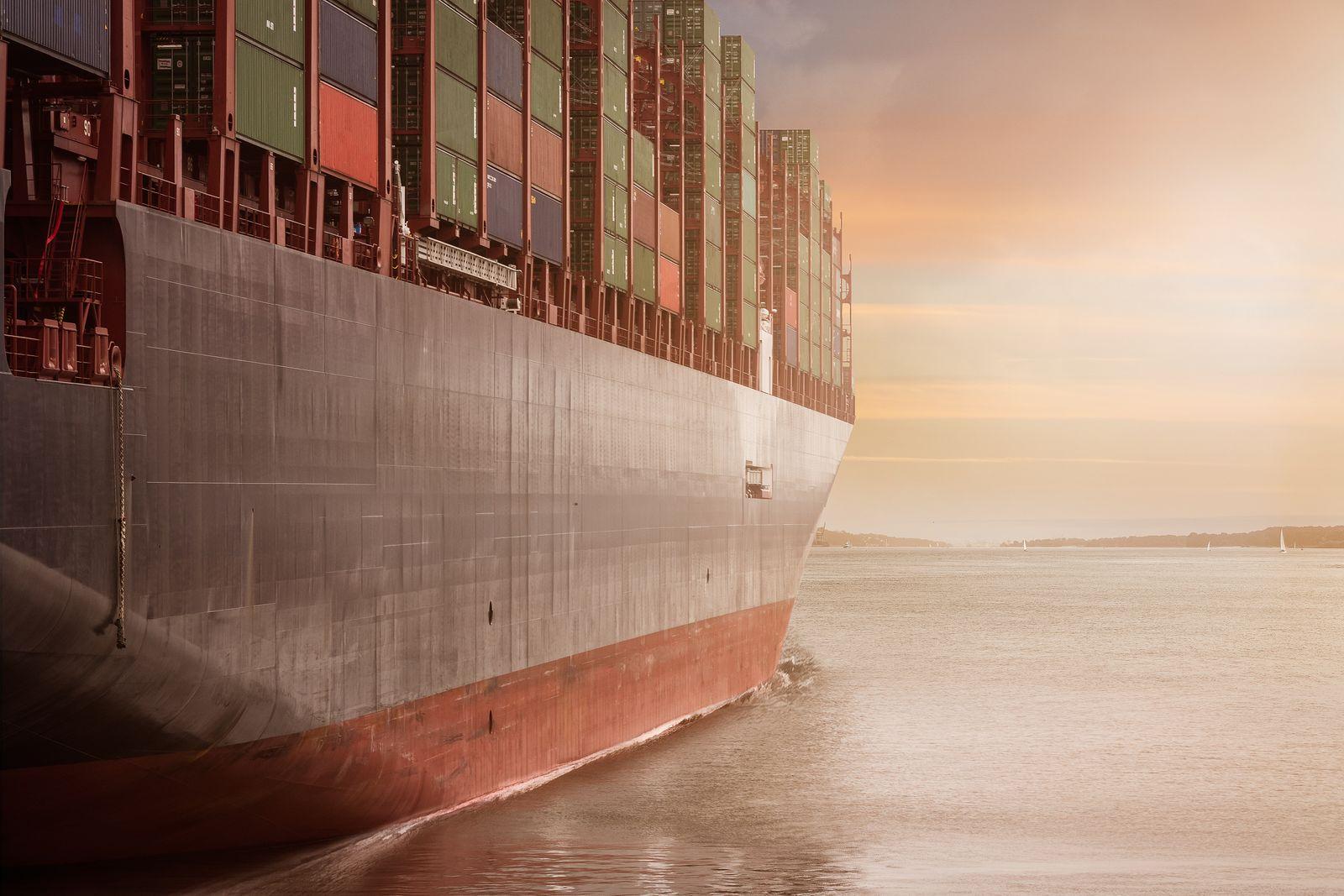 A fully laden container ship under way at sea